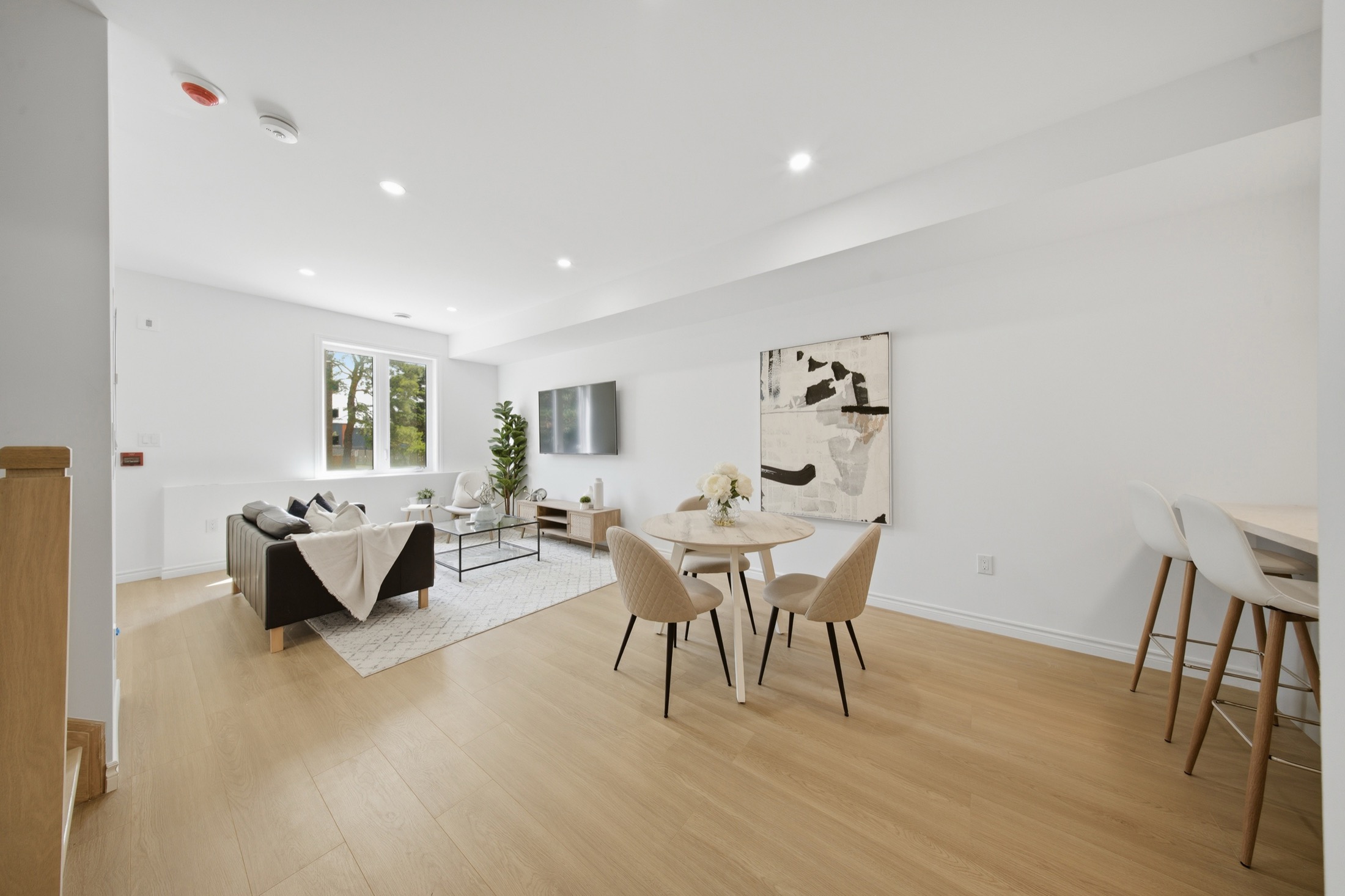 Dining area with wide-plank flooring and breakfast bar seating
