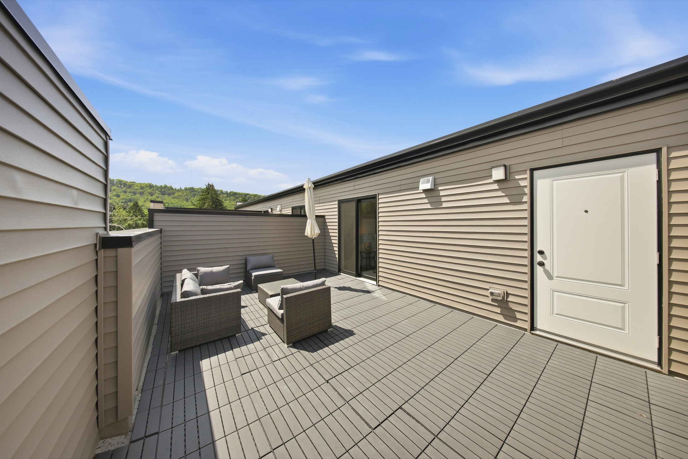 Private rooftop terrace with lounge seating at Sky Terraces