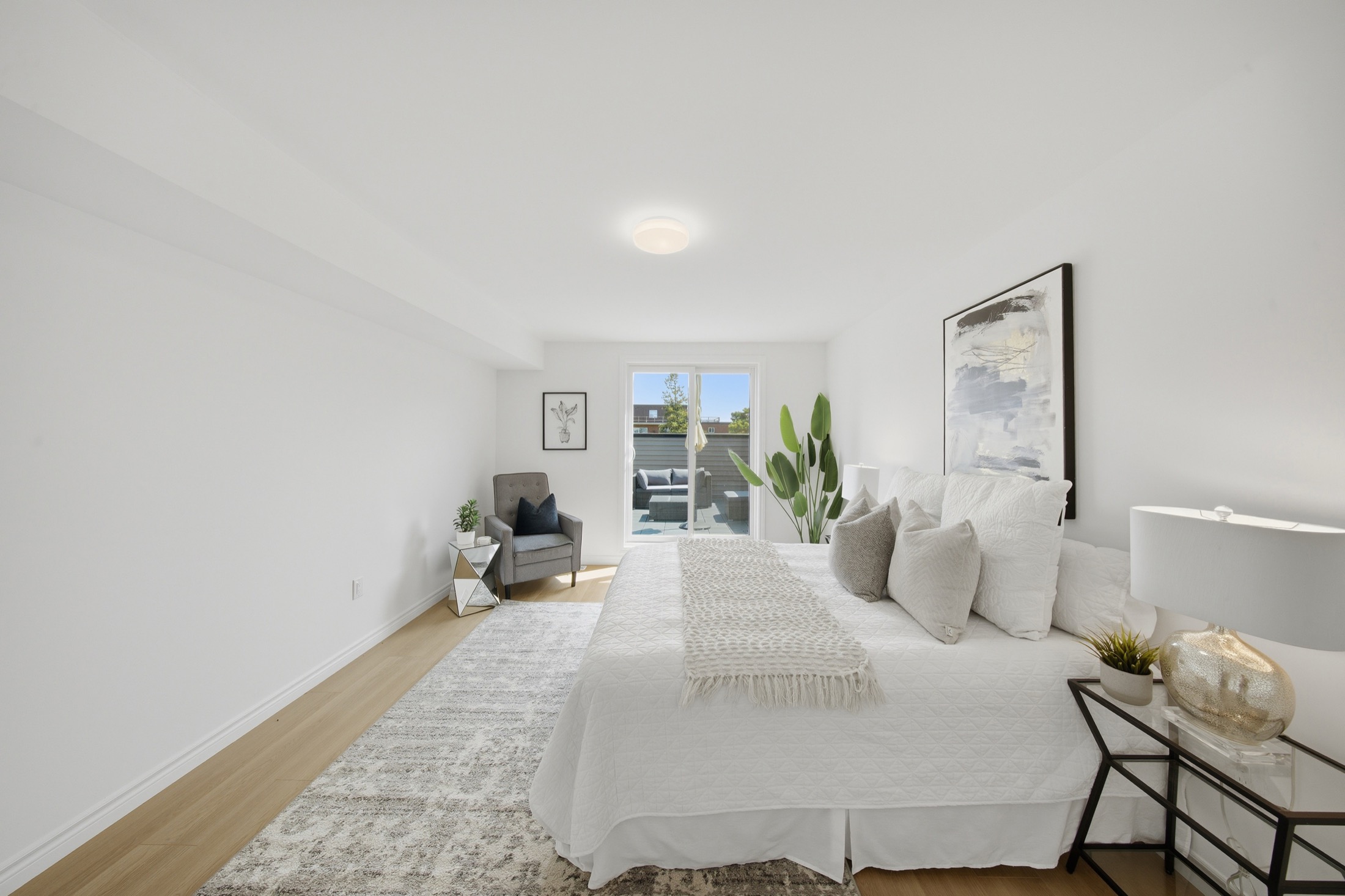 Primary bedroom with walk-out to the private rooftop terrace